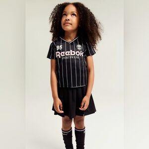 Reebok x HM  collection Jersey and Black Pleated Skirt